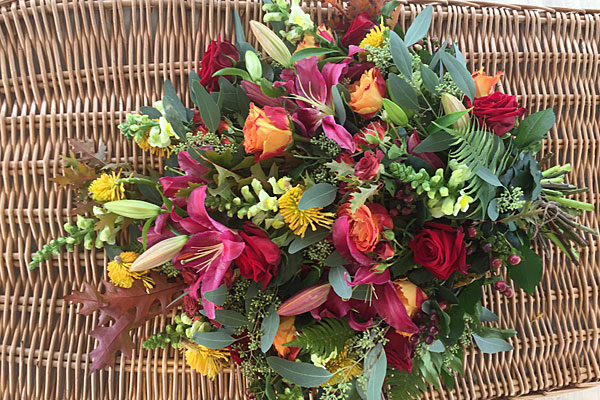 Flower bouquet on willow coffin